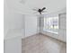 Bright bedroom featuring a Murphy bed and custom built-in shelves and cabinets at 2405 Dakota Rock Dr, Ruskin, FL 33570