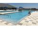 Resort-style zero entry community pool featuring a large sun deck and sun loungers at 2405 Dakota Rock Dr, Ruskin, FL 33570