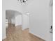 Bright foyer featuring light wood floors and modern arched openings leading to other rooms at 2405 Dakota Rock Dr, Ruskin, FL 33570