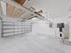 Spacious garage with ample storage racks and a water heater at 2405 Dakota Rock Dr, Ruskin, FL 33570