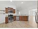 Kitchen featuring stainless steel appliances, granite countertops, and wooden cabinets at 2405 Dakota Rock Dr, Ruskin, FL 33570