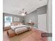 Spacious main bedroom featuring light wood accents and a ceiling fan at 2405 Dakota Rock Dr, Ruskin, FL 33570
