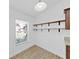 Pantry area features an exterior window and floating wooden shelves at 2405 Dakota Rock Dr, Ruskin, FL 33570