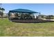 Community playground featuring a covered play structure, swings, and a picnic table, ideal for Gathering fun and outdoor activities at 2405 Dakota Rock Dr, Ruskin, FL 33570