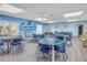 Activity room with tables, chairs and wood-look floors at 2567 Oakleaf Ln # 41B, Clearwater, FL 33763