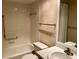 Cozy bathroom featuring a tiled shower and tub combination, updated sink and a toilet at 2567 Oakleaf Ln # 41B, Clearwater, FL 33763