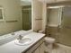 Well-lit bathroom features a pristine vanity, updated shower with glass doors, and modern fixtures throughout at 2567 Oakleaf Ln # 41B, Clearwater, FL 33763
