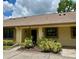 Cozy single story home with a lovely landscaped yard and warm neutral tones offers a welcoming curb appeal at 2567 Oakleaf Ln # 41B, Clearwater, FL 33763