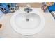 Close up of bathroom sink with crystal faucet and neutral countertop at 2604 Clareside Dr, Valrico, FL 33596