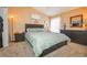 Bedroom with carpet, vaulted ceiling, accent wall art and contemporary lamps at 2604 Clareside Dr, Valrico, FL 33596