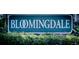 Bloomingdale community sign surrounded by lush landscaping, showcasing the neighborhood's natural beauty at 2604 Clareside Dr, Valrico, FL 33596