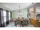 Elegant dining room featuring modern chandelier lighting and an inviting atmosphere for Gathering gatherings at 2604 Clareside Dr, Valrico, FL 33596