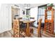 Inviting dining area with wood table, bar and view to the laundry room at 2604 Clareside Dr, Valrico, FL 33596
