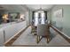 Elegant dining room with a chandelier, large rug, and seating for six at 2604 Clareside Dr, Valrico, FL 33596