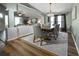 Dining area showcases wood floors and opens to living area at 2604 Clareside Dr, Valrico, FL 33596