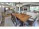 Spacious dining area open to the living room, perfect for entertaining with an elegant chandelier at 2604 Clareside Dr, Valrico, FL 33596