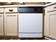 The kitchen features a white dishwasher with adjacent cabinets at 2604 Clareside Dr, Valrico, FL 33596