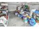 A cluttered garage provides potential for storage and organization with ample space at 2604 Clareside Dr, Valrico, FL 33596