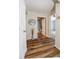 Inviting hallway with stylish decor and wood-style floors leading to a bathroom and bedroom at 2604 Clareside Dr, Valrico, FL 33596