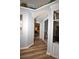 Inviting hallway with hardwood floors leads to bedrooms, showcasing the home's functional layout and design at 2604 Clareside Dr, Valrico, FL 33596