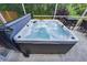 Close up of the hot tub on the screened-in patio at 2604 Clareside Dr, Valrico, FL 33596