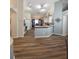 Open-concept kitchen with white cabinetry, modern appliances, and a view to the dining area at 2604 Clareside Dr, Valrico, FL 33596