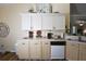 Functional kitchen with ample counter space, white cabinets, and modern appliances at 2604 Clareside Dr, Valrico, FL 33596