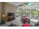 Large screened lanai featuring seating and view of the private backyard at 2604 Clareside Dr, Valrico, FL 33596