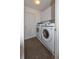 The laundry room features a washer, dryer, overhead cabinets, and neutral flooring at 2604 Clareside Dr, Valrico, FL 33596