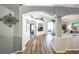 Inviting living room featuring wood floors, archways, and entertainment center at 2604 Clareside Dr, Valrico, FL 33596