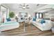 Bright living room with stylish white sofas, hardwood floors, and modern decor at 2604 Clareside Dr, Valrico, FL 33596