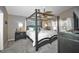 Comfortable bedroom features a canopy bed, ceiling fan, and plenty of natural light at 2604 Clareside Dr, Valrico, FL 33596