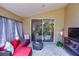 Covered patio features an adjacent sun room with a red sofa at 2604 Clareside Dr, Valrico, FL 33596