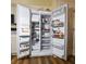 The refrigerator is open, stocked with a variety of food items and condiments at 2604 Clareside Dr, Valrico, FL 33596