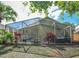 Enjoy outdoor living in this spacious screened patio with a hot tub and dining area at 2604 Clareside Dr, Valrico, FL 33596