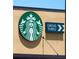 Exterior shot of a Starbucks drive-thru sign, indicating convenient access to coffee at 2604 Clareside Dr, Valrico, FL 33596