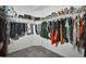 Well-organized walk-in closet, providing space for clothing and accessories at 2604 Clareside Dr, Valrico, FL 33596