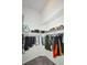 Spacious walk-in closet featuring ample shelving and hanging space for organized storage in the home at 2604 Clareside Dr, Valrico, FL 33596