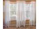 Bright window with white curtains, offering natural light and privacy at 2604 Clareside Dr, Valrico, FL 33596