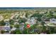 Drone shot pinpointing the property location with lush trees and scenic views of the surrounding community at 3001 Folklore Dr, Valrico, FL 33596