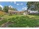 Large screened-in lanai overlooking the backyard, creating a relaxing outdoor living space at 3001 Folklore Dr, Valrico, FL 33596