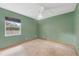 A bedroom featuring plush carpeting, a ceiling fan, neutral tones, and natural light at 3001 Folklore Dr, Valrico, FL 33596