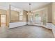 Bright dining area with tile floors, wainscoting, and arched windows with blinds at 3001 Folklore Dr, Valrico, FL 33596
