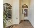 Inviting front entry with tiled pathway, decorative window, and neutral stucco facade at 3001 Folklore Dr, Valrico, FL 33596