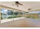 A screened lanai with three ceiling fans provides an outdoor living space at 3001 Folklore Dr, Valrico, FL 33596