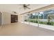 Spacious screened lanai with lovely garden and comfortable seating at 3001 Folklore Dr, Valrico, FL 33596