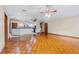Inviting living room area with open access to the kitchen and stylish wood flooring at 3001 Folklore Dr, Valrico, FL 33596