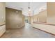 Spacious living room with decorative lighting, tile floors, and sliding glass doors at 3001 Folklore Dr, Valrico, FL 33596