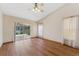 Bright and airy living room with sliding glass doors leading to an outdoor patio at 3001 Folklore Dr, Valrico, FL 33596