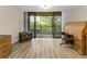 Bright room with balcony access, beautiful nature views, and well-appointed office furnishings at 3062 Eastland Blvd # 402, Clearwater, FL 33761